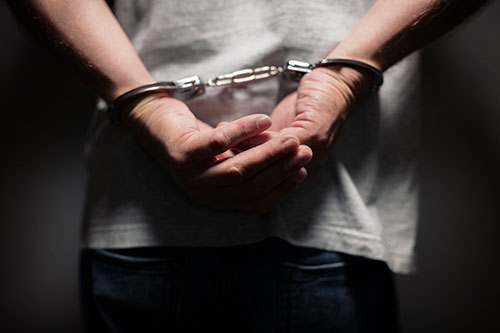 criminal-in-handcuffs-PTNKNY4 criminal-in-handcuffs-PTNKNY4