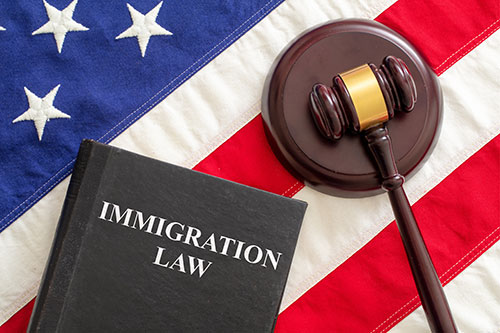judge-gavel-and-immigration-law-book-on-united Immigration Law
